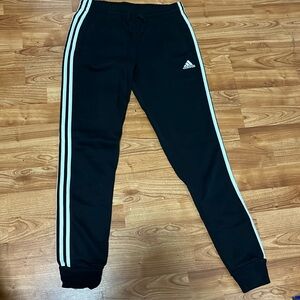 Adidas Black joggers with signature three stripe logo. Size Small.